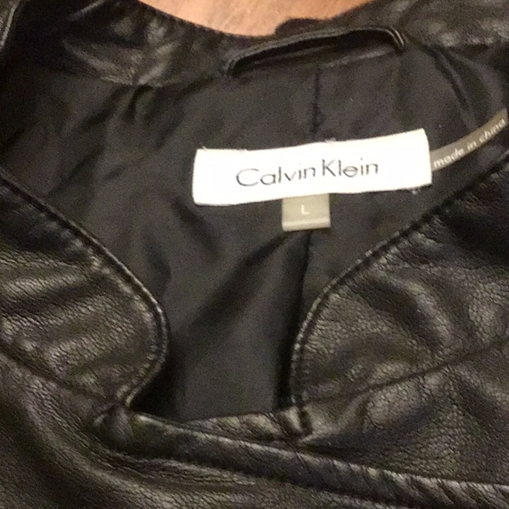 Black motorcycle style jacket. zippers work,